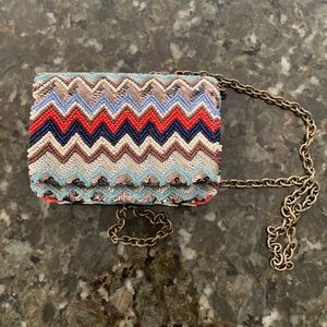 Chevron print beaded mini Santi clutch with chain strap.